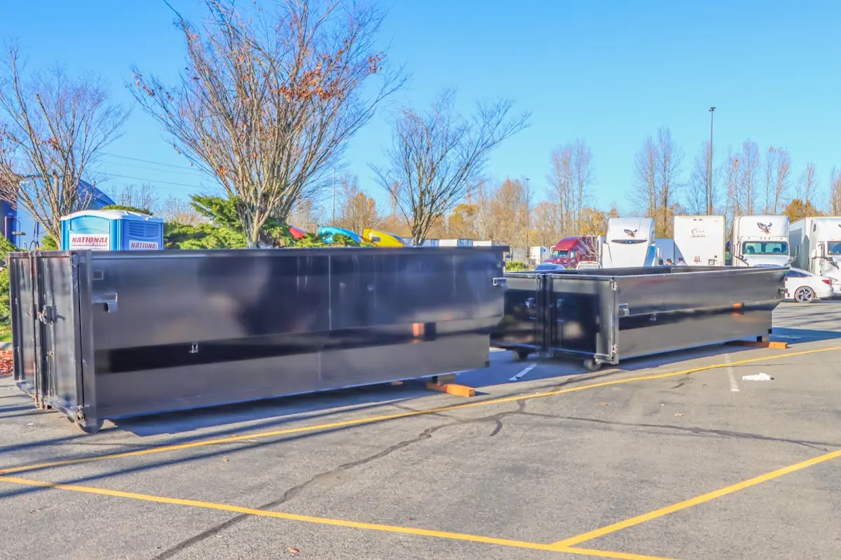 Professional dumpster rental service with roll-off container on residential driveway in Oakbrook